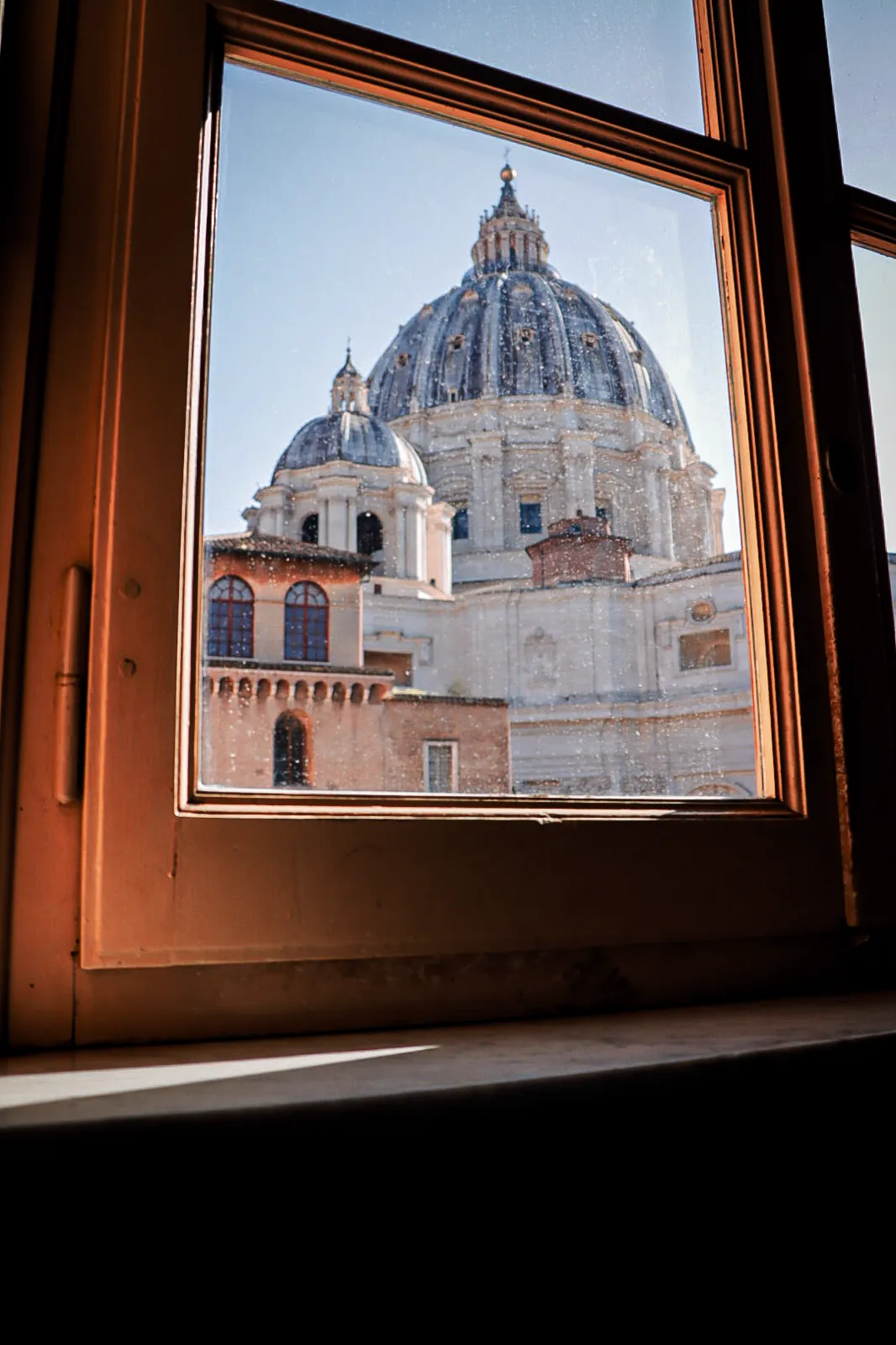 Dome of St Peter's framed by a window, Rome